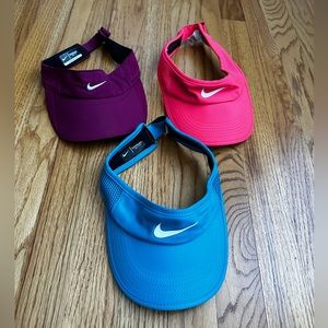 THREE Nike Featherlight Dri-Fit Visors. Lightly used. No stains.Non Smoking Home
